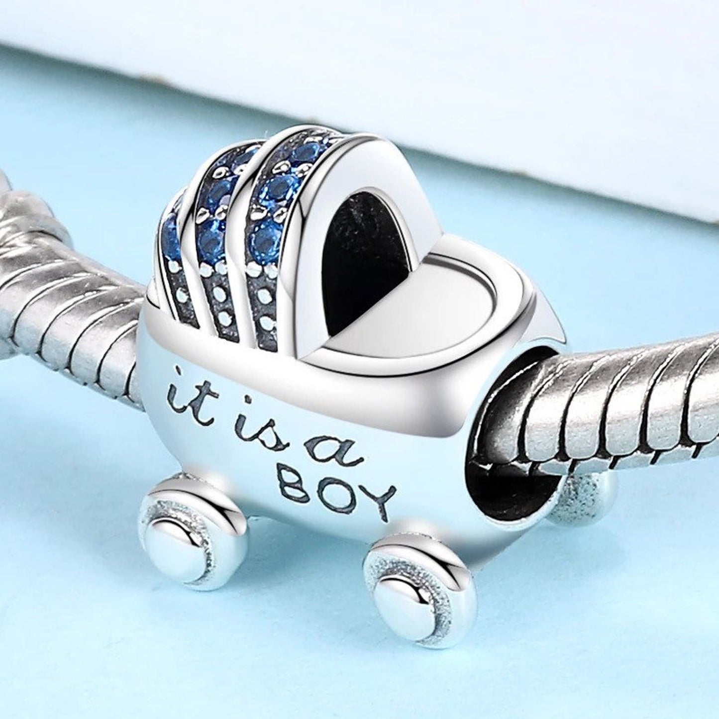 It is a Boy Baby Carriage Buggy Charm for Bracelet, S925 Sterling Silver